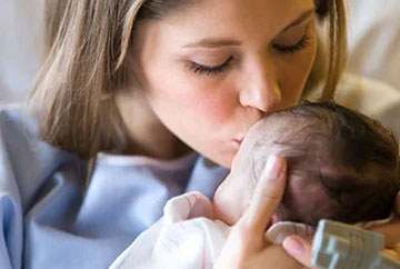 Mother saving baby with AED